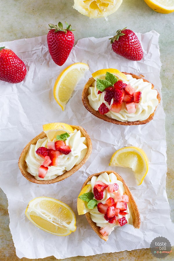 Light and lemony, these Lemon Cream Taco Boats have cinnamon-sugar coated tortilla boats filled with a creamy, luscious lemon cream. Top them off with diced strawberries for a perfect summer treat.