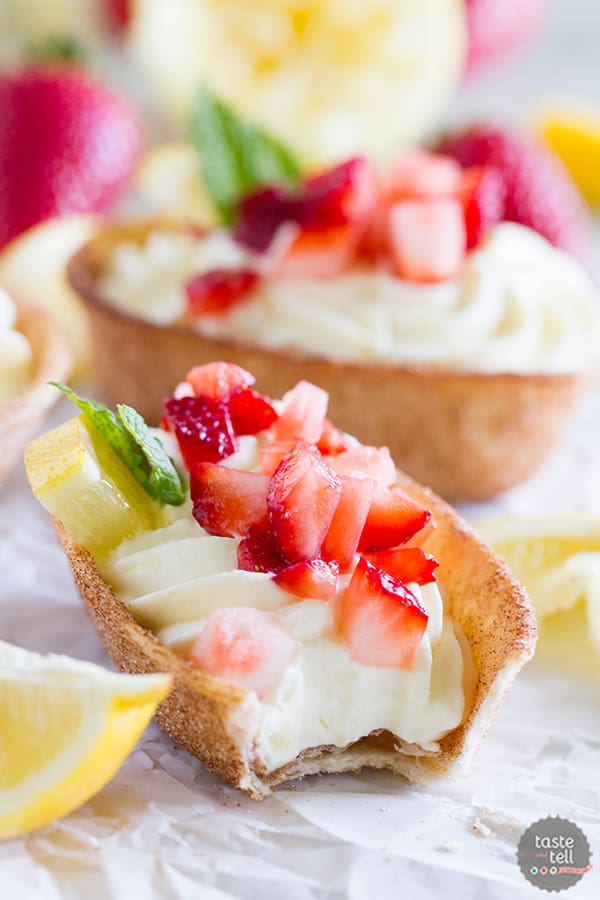 Light and lemony, these Lemon Cream Taco Boats have cinnamon-sugar coated tortilla boats filled with a creamy, luscious lemon cream. Top them off with diced strawberries for a perfect summer treat.