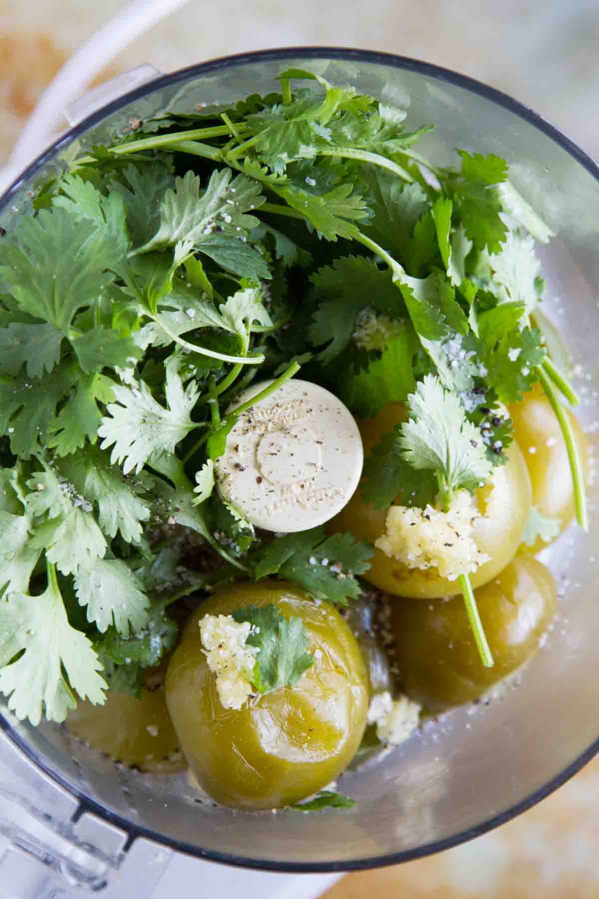 Making tomatillo salsa verde in a food processor