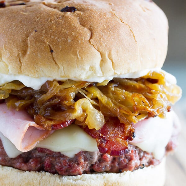 The ultimate hamburger! Pork lovers will go crazy for these Triple Pork Burgers - beef and pork patties topped with ham, bacon, and lots of caramelized onions. It’s a flavor explosion!