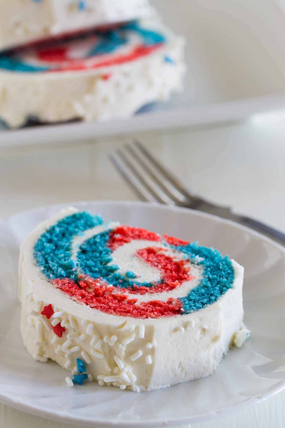 slice of 4th of July Cake Roll showing red and blue interior