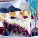 Hit up the farmer’s market for fresh cherries and blueberries and turn them into this Cherry and Blueberry Cream Pie! Fresh berries are combined with a creamy sour cream filling and topped with plenty of streusel for a perfect summer pie.