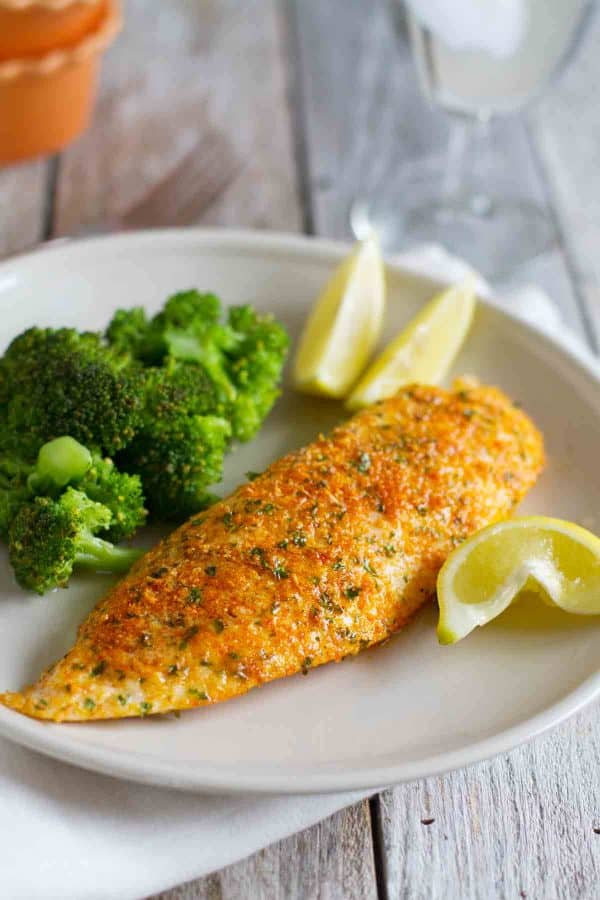This Parmesan Crusted Tilapia is a simple fish recipe that is done in 20 minutes and will even impress non-fish lovers!
