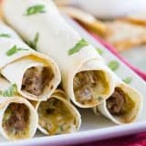 Forget the frying - these Mexican Shredded Beef Baked Taquitos are crisp and flavorful without the added calories. They freeze well, too!