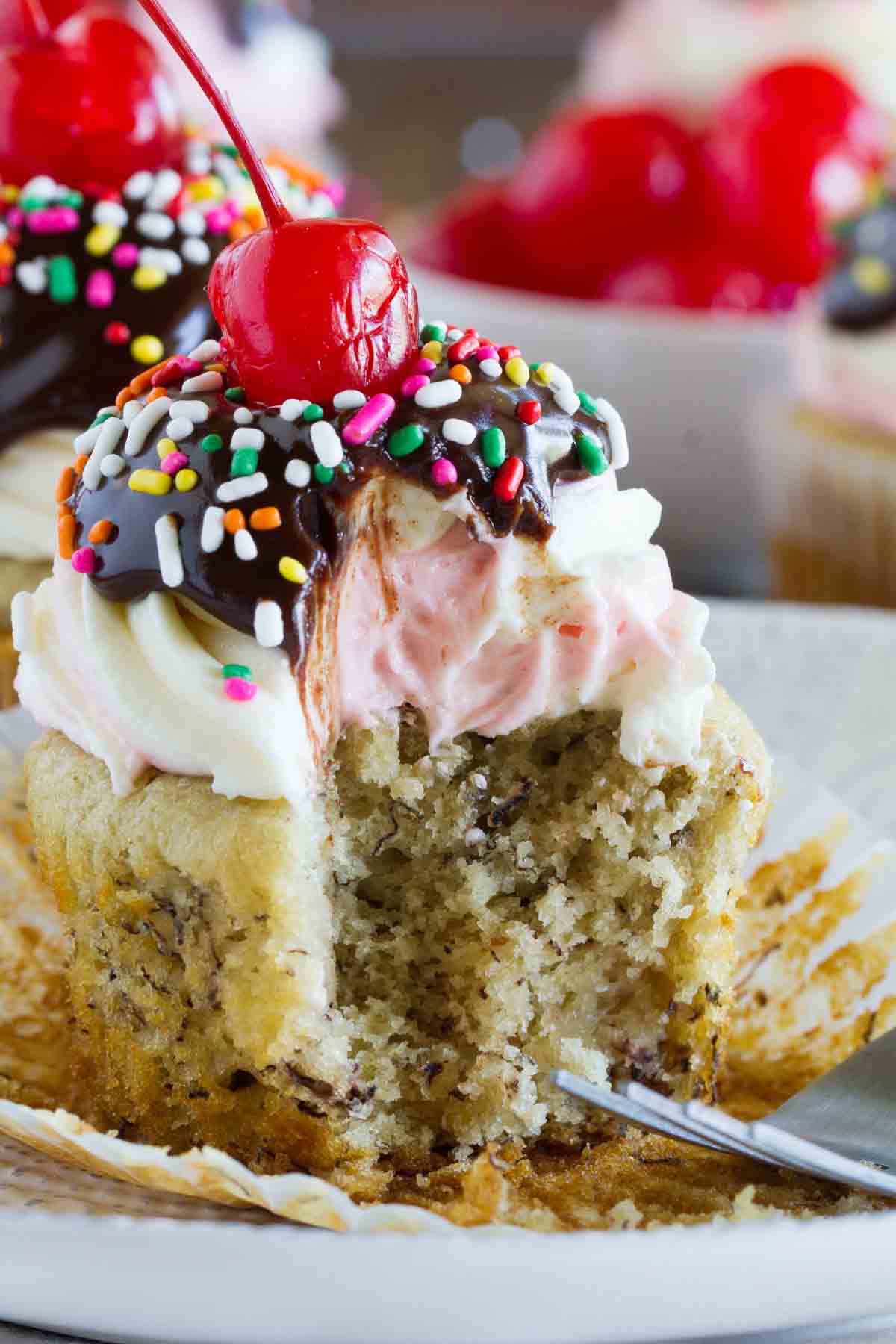 Banana Split Cupcake with a forkful taken to show texture