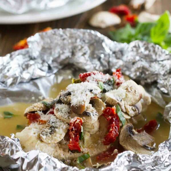 Healthy and fast, this Chicken Milano Foil Packet Recipe is great for a weeknight. The chicken is moist and flavorful, and clean up is a breeze!