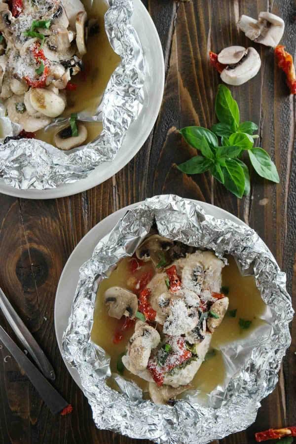 Healthy and fast, this Chicken Milano Foil Packet Recipe is great for a weeknight.  The chicken is moist and flavorful, and clean up is a breeze!