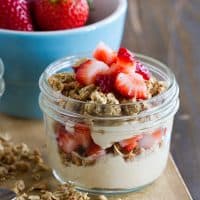 Peanut Butter and Jelly Yogurt Parfait Recipe topped with strawberries.