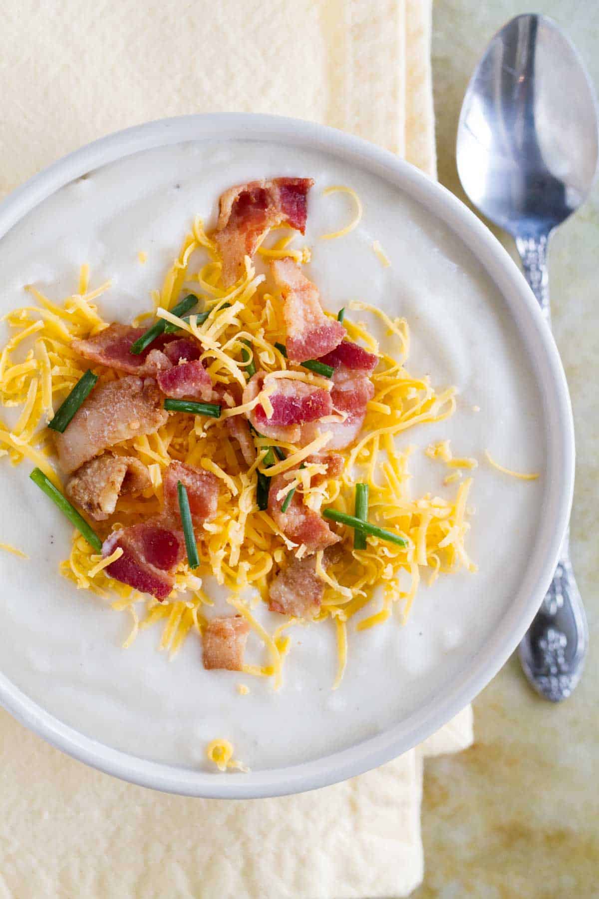 overhead view of Potato Soup topped with cheese and bacon