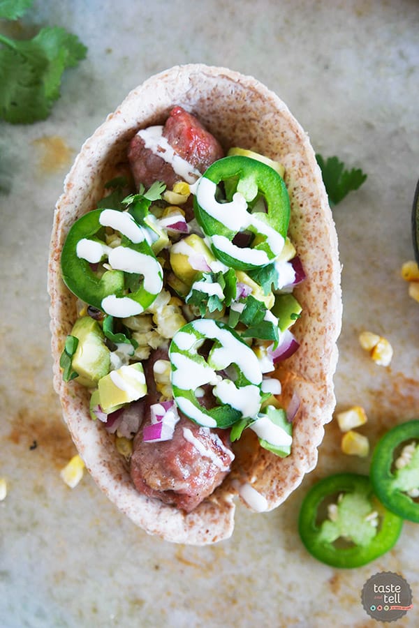 Load it up! These Tex-Mex Bratwurst Boats are filled will all kinds of goodness and are easy to eat because they are served up in a tortilla boat instead of on a bun!