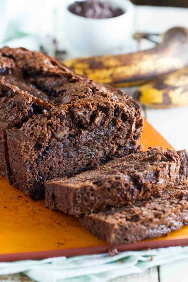 Loaf of sliced Brownie Mix Banana Bread on a cutting board.