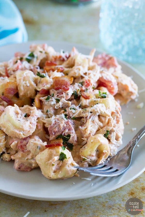 This Creamy Tomato Tortellini with Chicken and Bacon is super simple and makes a perfect weeknight dinner. Frozen tortellini and rotisserie chicken make it a super fast meal, too!