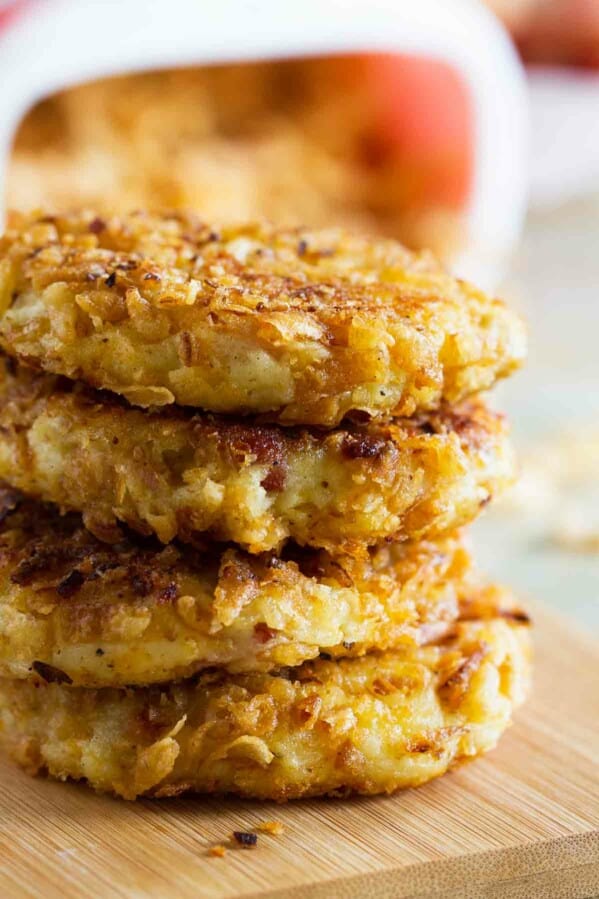 Four crispy onion potato pancakes stacked on top of each other.