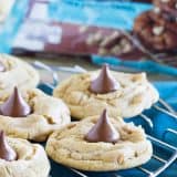 Sweet and a little salty, these Sea Salt Caramel Chip Blossom Cookies are a twist on the traditional blossom cookie that is perfect for holiday baking, or just for filling the cookie jar!