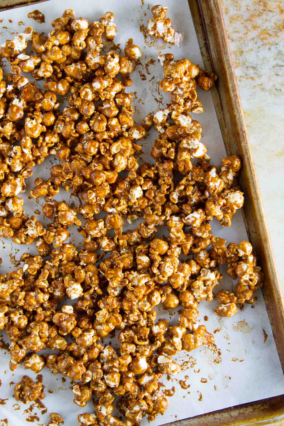 Caramel Gingerbread Popcorn on a baking sheet