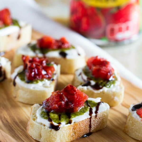 A true crowd pleasing appetizer, this Feta, Pesto and Tomato Bruschetta is a tasty appetizer that can be served year round. Perfect as a starter or as a holiday party appetizer.