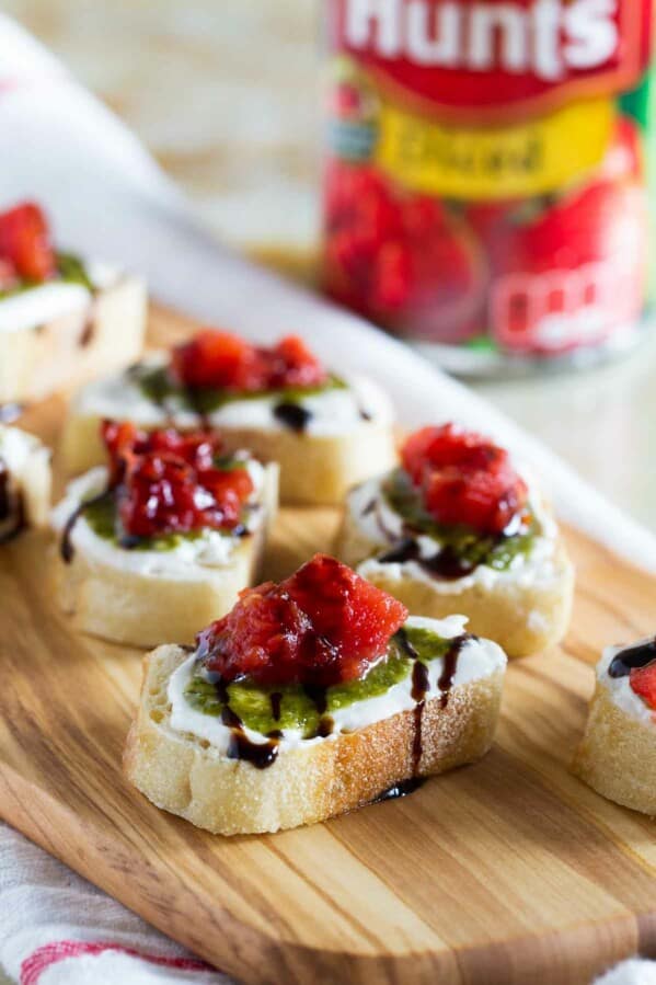 A true crowd pleasing appetizer, this Feta, Pesto and Tomato Bruschetta is a tasty appetizer that can be served year round. Perfect as a starter or as a holiday party appetizer.