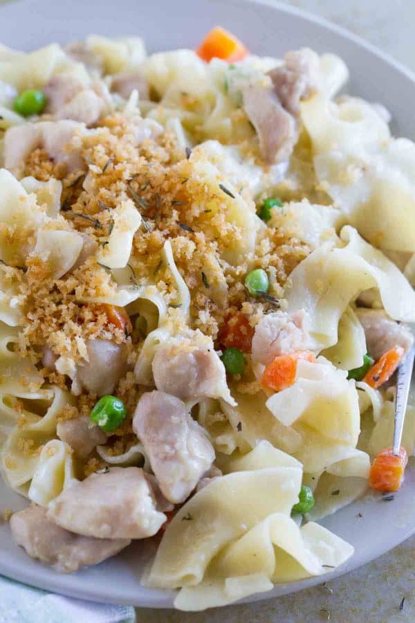 The flavors of chicken pot pie - in pasta form! This Chicken Pot Pie Ragu combines a creamy chicken gravy with pasta for a comforting, warming dinner.