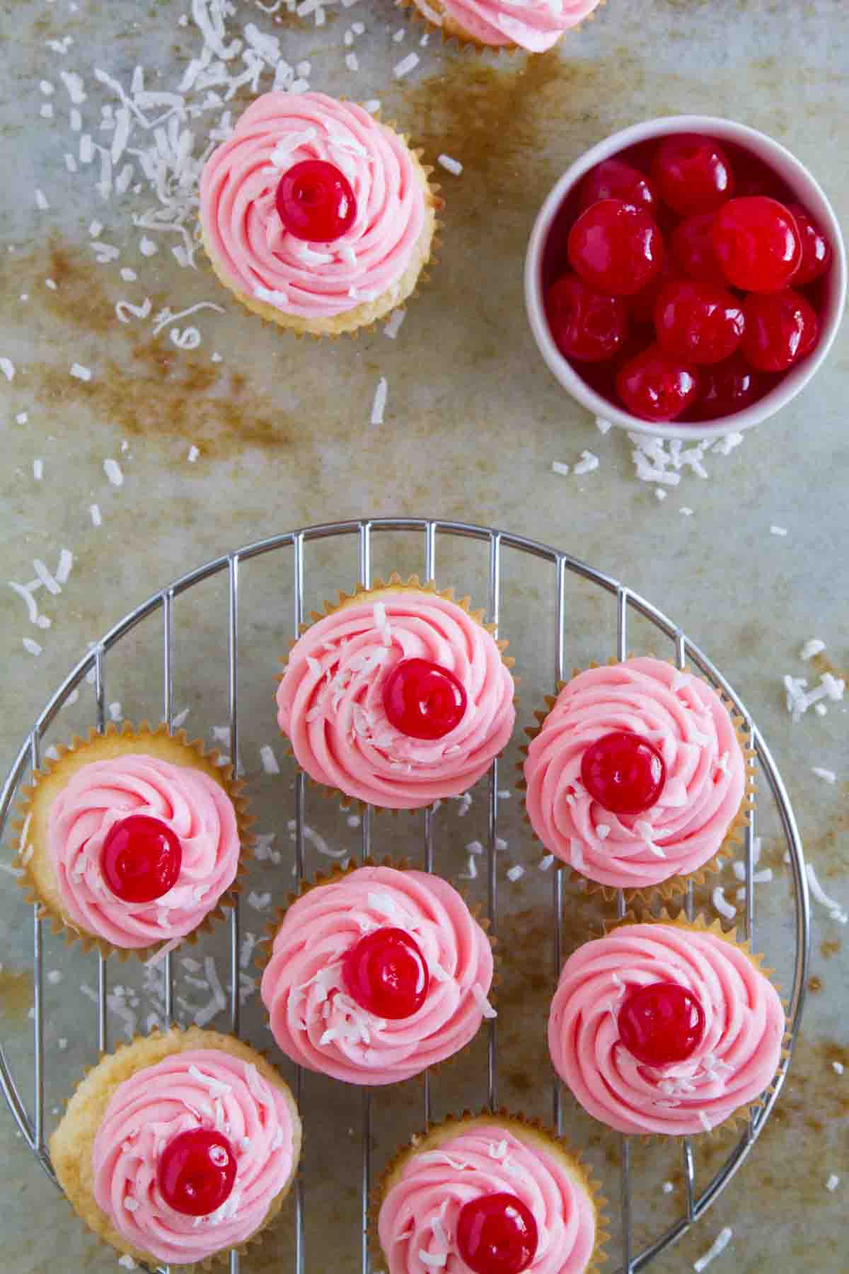 Pink cupcakes with cherries