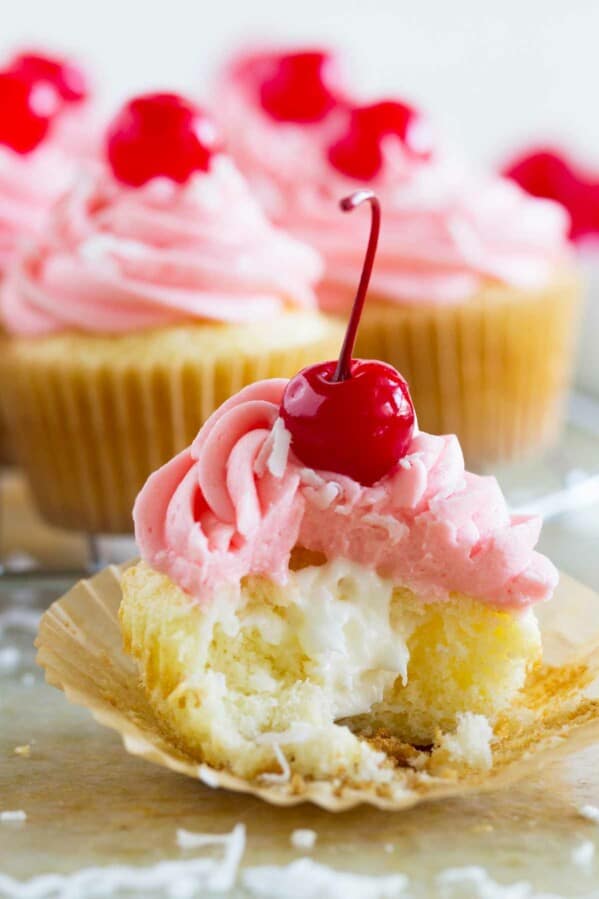 filled cupcake with cherry buttercream