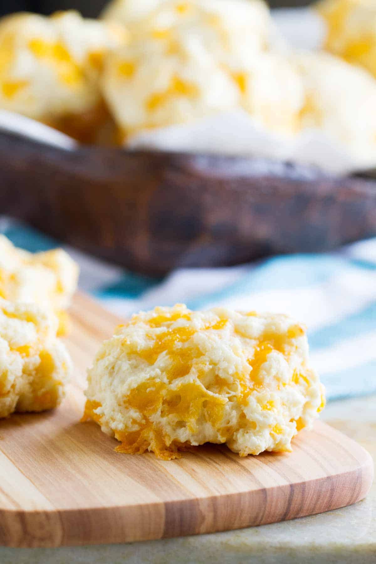 Garlic and Cheddar Sour Cream Biscuits on a cutting board