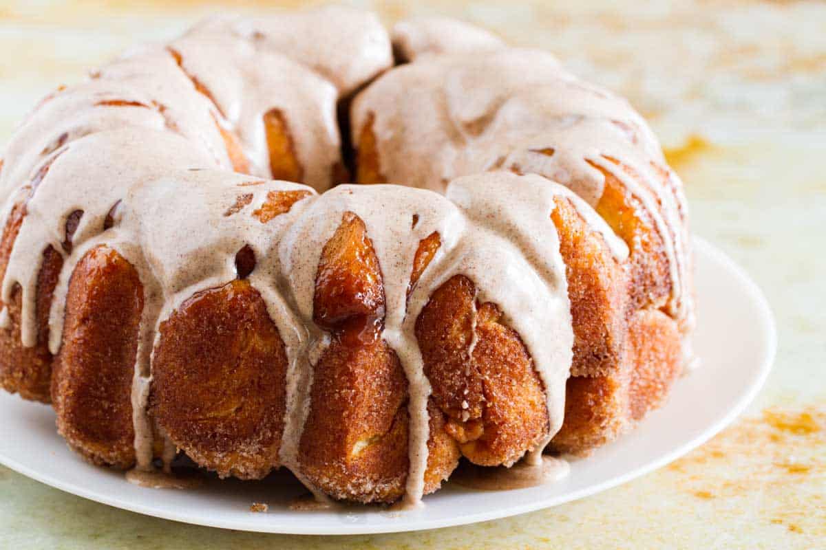 monkey bread with a glaze on a plate