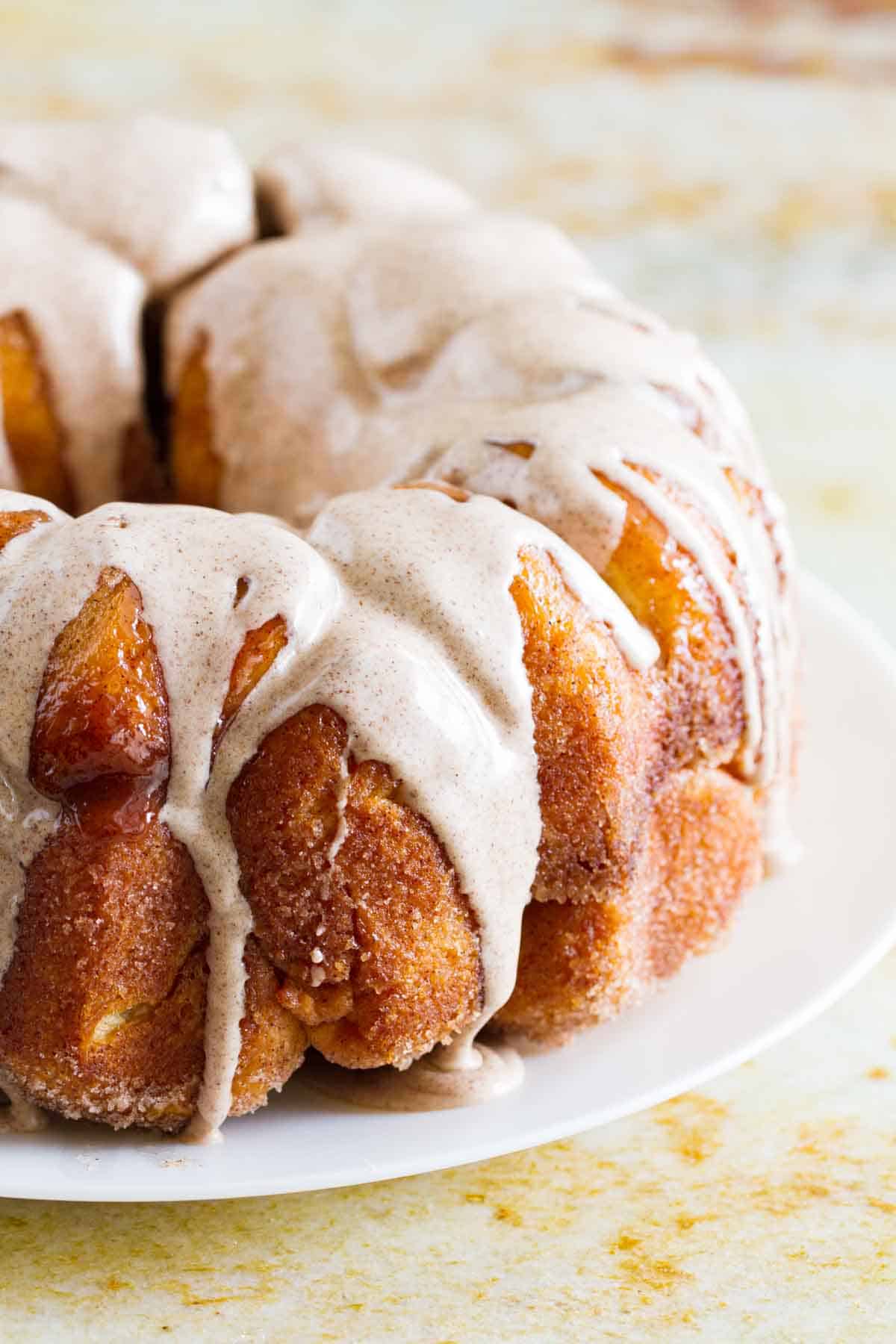 Monkey Bread with Cinnamon Icing on a white plate