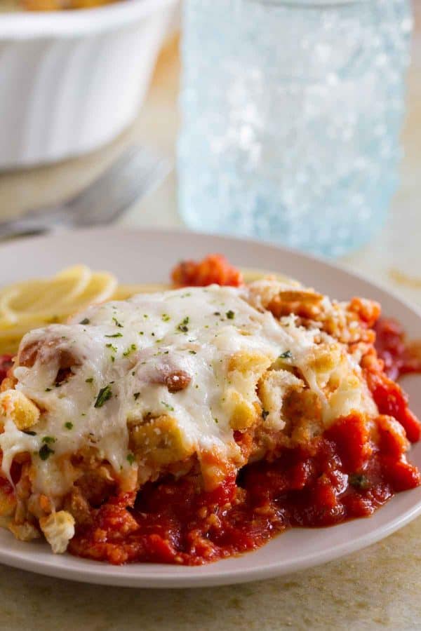 Forget the time and effort of breading and frying chicken - this Cheater Chicken Parmesan Bake gives you the same flavors and crispy texture from chicken parmesan with half the effort!