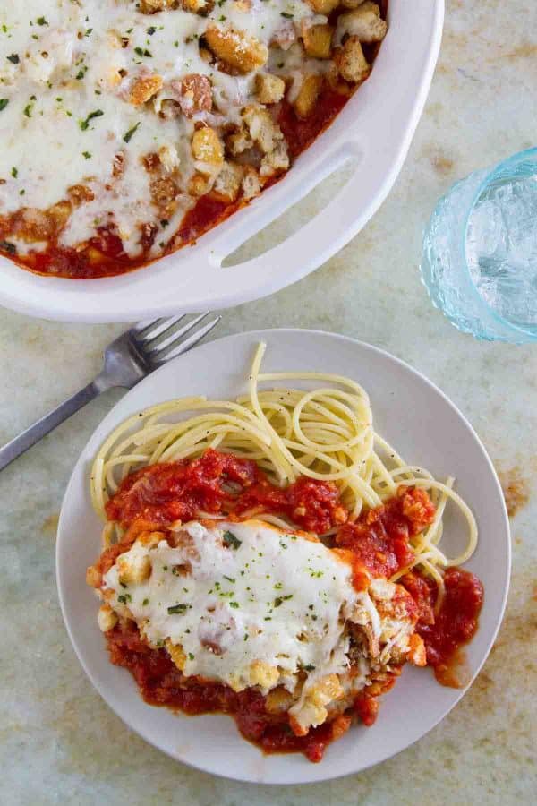 Forget the time and effort of breading and frying chicken - this Cheater Chicken Parmesan Bake gives you the same flavors and crispy texture from chicken parmesan with half the effort!