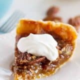 slice of Pecan Pie with Whipped Cream on top