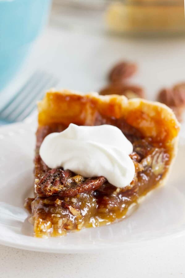 slice of Pecan Pie with Whipped Cream on top