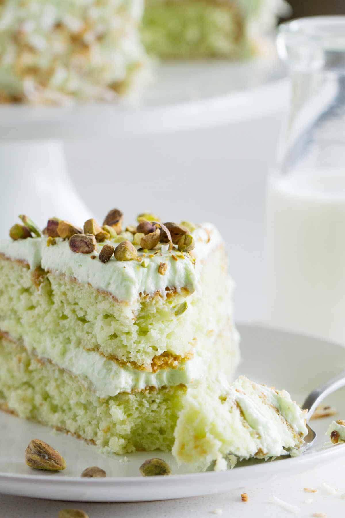 Pistachio Cake - aka Watergate Cake - with a bite taken from it.