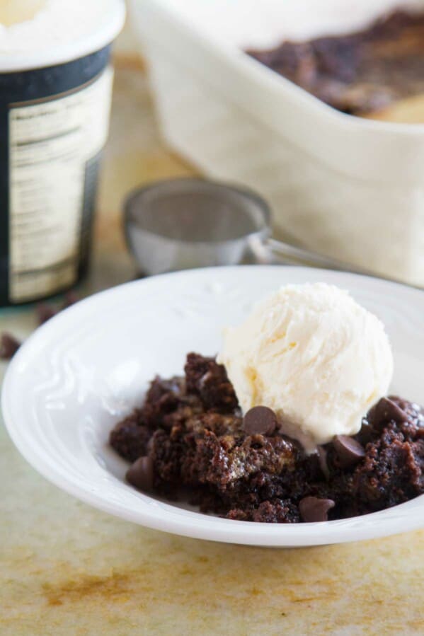 Anyone can make this ridiculously easy Gooey Caramel Chocolate Dump Cake. No box mixes, only a short amount of time to throw it together, and this humble cake can be satisfying any chocolate craving.