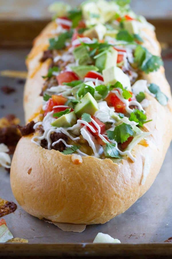 Taco Tuesday looks a little different with this Taco French Bread Pizza taking center stage! All of your favorite taco flavors are nested in a loaf of French bread for a dinner the whole family loves.