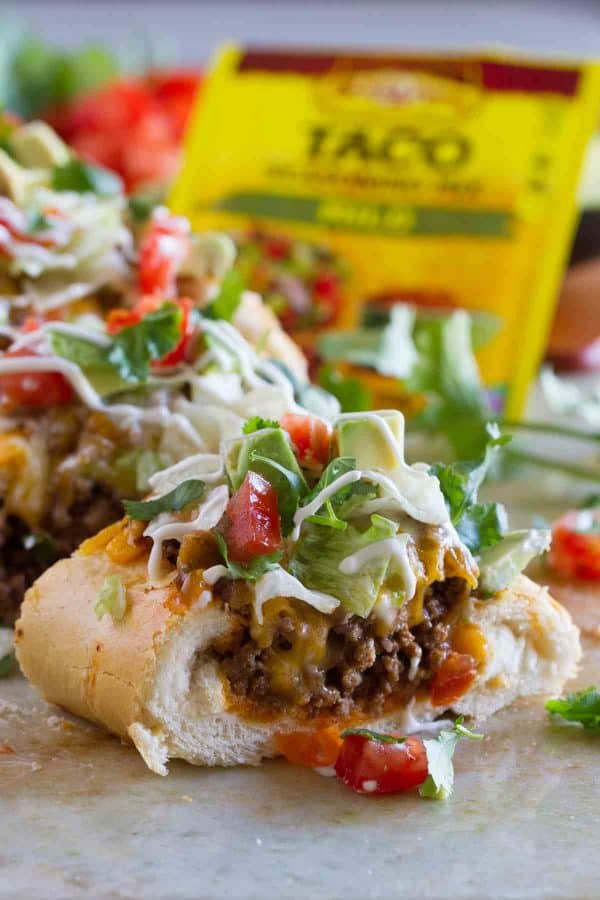 Taco Tuesday looks a little different with this Taco French Bread Pizza taking center stage! All of your favorite taco flavors are nested in a loaf of French bread for a dinner the whole family loves.