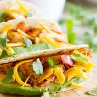 Chicken Bacon Avocado Tacos on a cutting board.