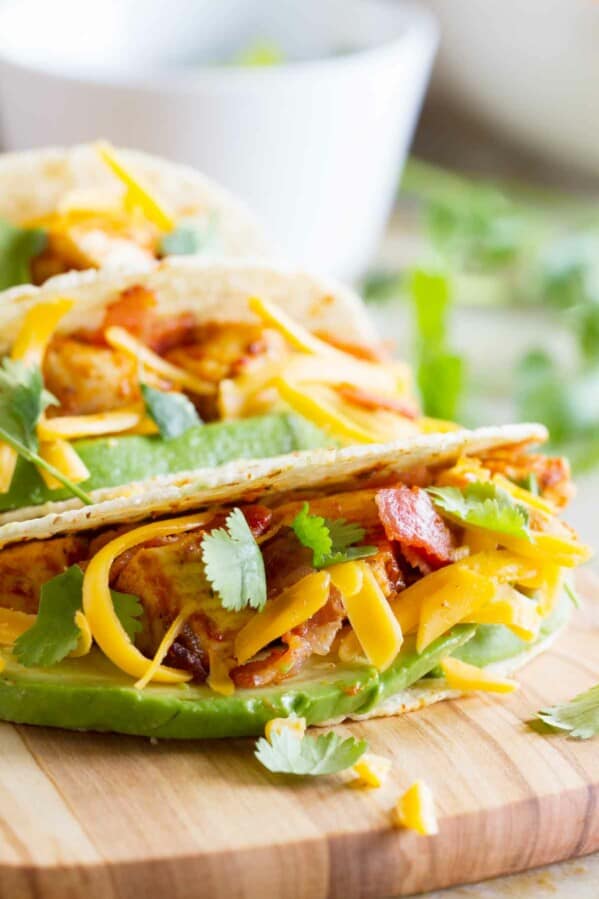 Chicken Bacon Avocado Tacos on a cutting board.