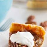 Slice of Classic Pecan Pie with Whipped Cream