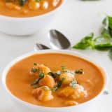 Two bowls filled with Creamy Slow Cooker Tomato Soup with Gnocchi.