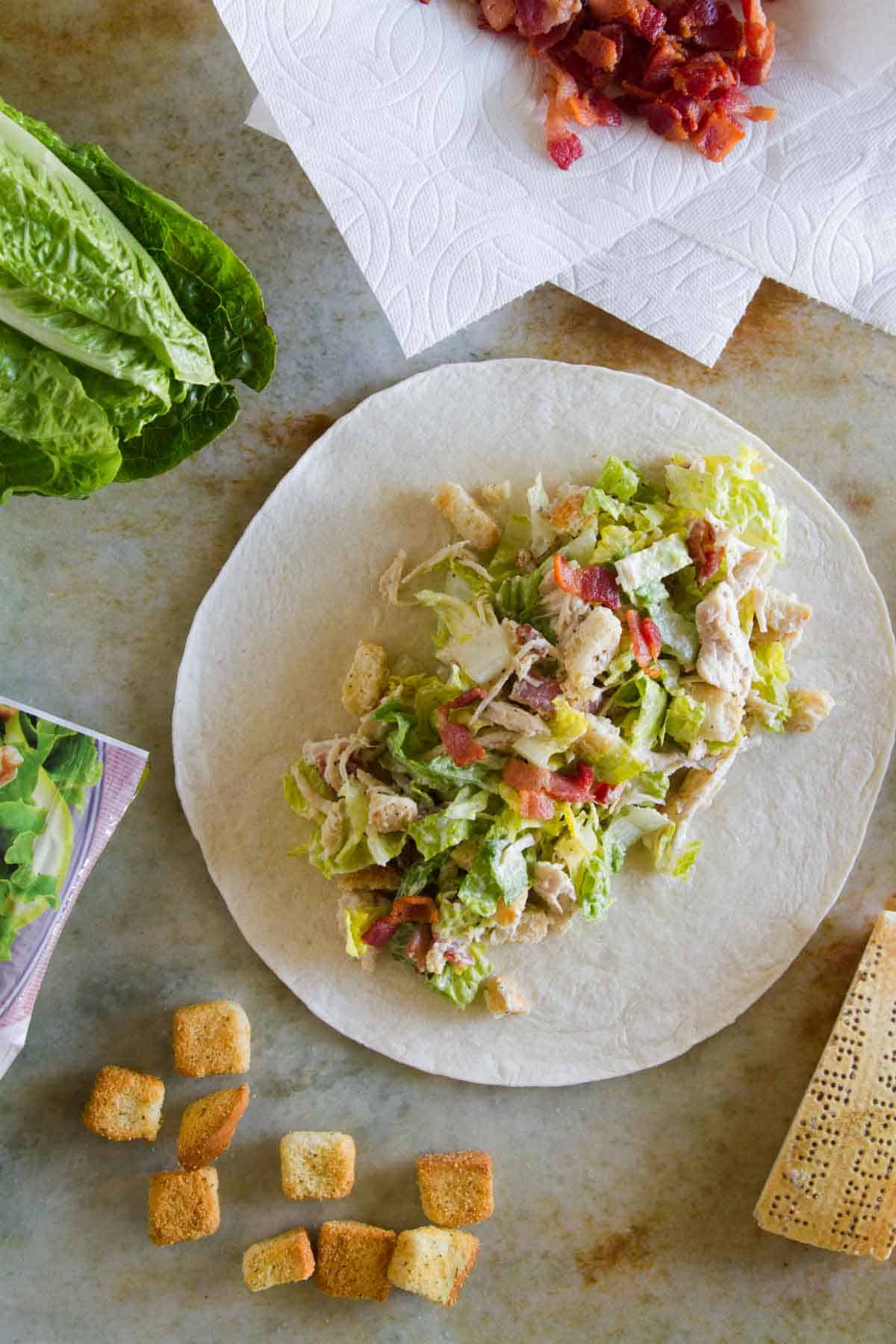 Wrap made with chicken caesar salad ingredients on the inside.