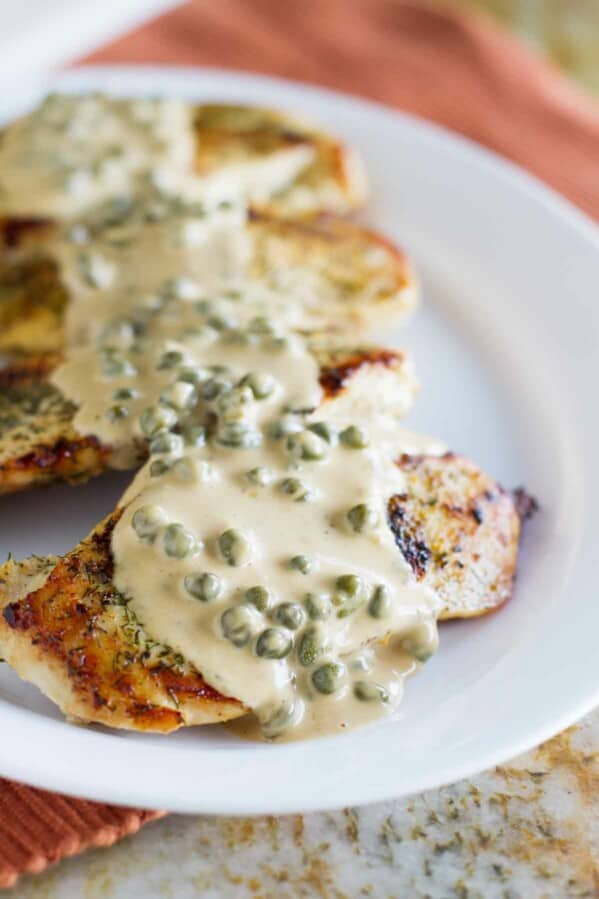 This Chicken in Caper Cream Sauce is an easy but elegant dinner recipe. Boneless chicken breasts are cooked in a skillet and served with a creamy caper cream sauce.