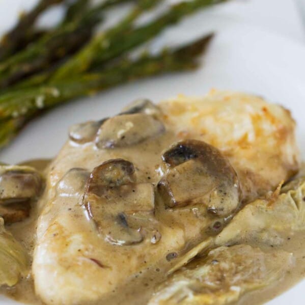 Chicken, mushrooms and artichokes are cooked in a creamy sauce, making this Creamy Artichoke Chicken a dreamy chicken dinner!