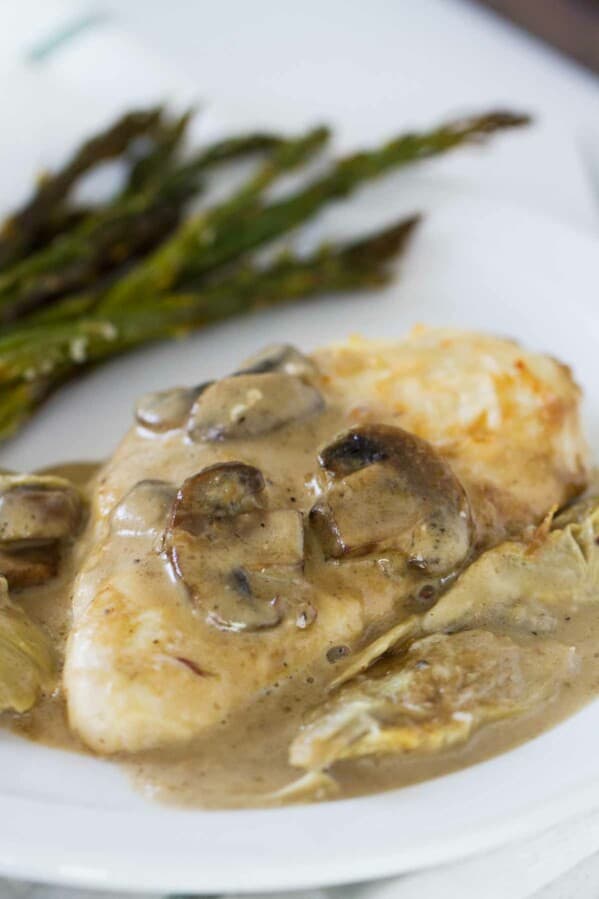 Chicken, mushrooms and artichokes are cooked in a creamy sauce, making this Creamy Artichoke Chicken a dreamy chicken dinner!