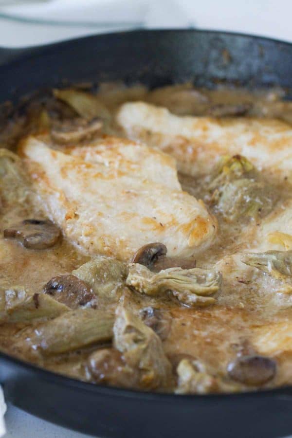 Chicken, mushrooms and artichokes are cooked in a creamy sauce, making this Creamy Artichoke Chicken a dreamy chicken dinner!
