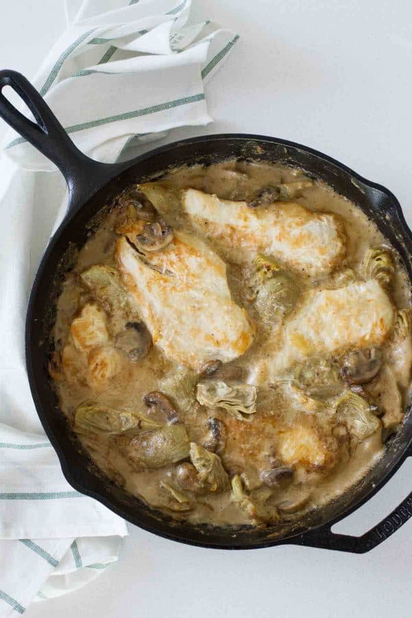 Chicken, mushrooms and artichokes are cooked in a creamy sauce, making this Creamy Artichoke Chicken a dreamy chicken dinner!