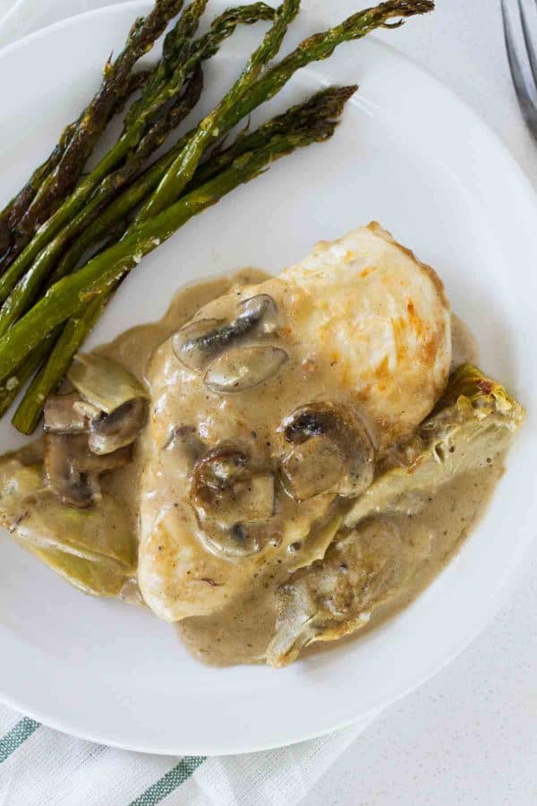 Chicken, mushrooms and artichokes are cooked in a creamy sauce, making this Creamy Artichoke Chicken a dreamy chicken dinner!
