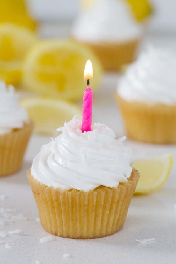 Bring in a little bit of sunshine with these Lemon Sunshine Cupcakes! Based on an old favorite cake, these cupcakes are filled with lemon curd and topped with a dreamy fluffy frosting. A sprinkling of coconut tops them off.