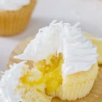 Lemon sunshine cupcake cut open to show the lemon filling in the center.