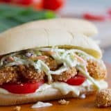 Shrimp Po Boy Sandwich with pineapple slaw and tomatoes.