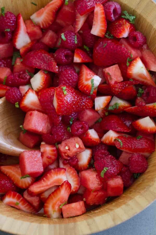 Crown Ruby Fruit Salad with raspberries, strawberries, watermelon, and lime dressing.